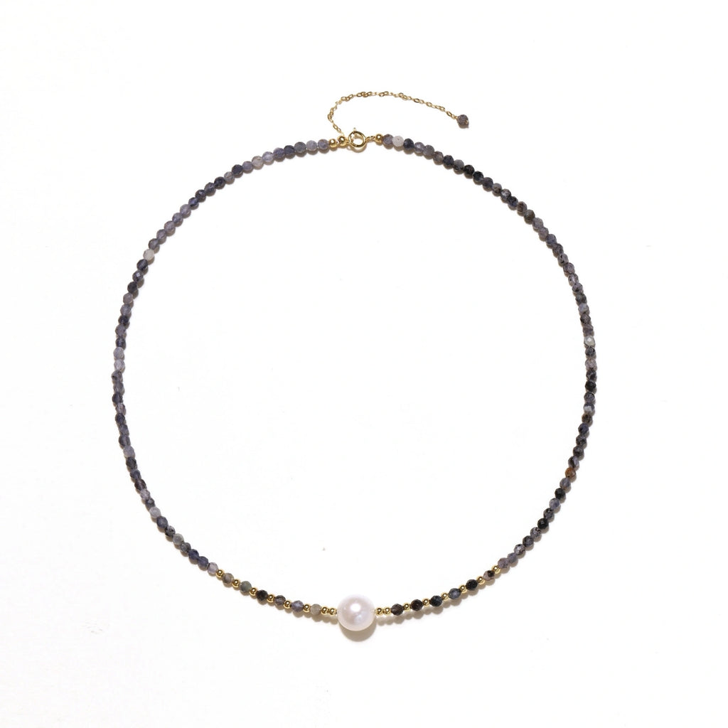 Dainty necklace with faceted purple iolite beads, gold vermeil accents, and central pink-white freshwater pearl.