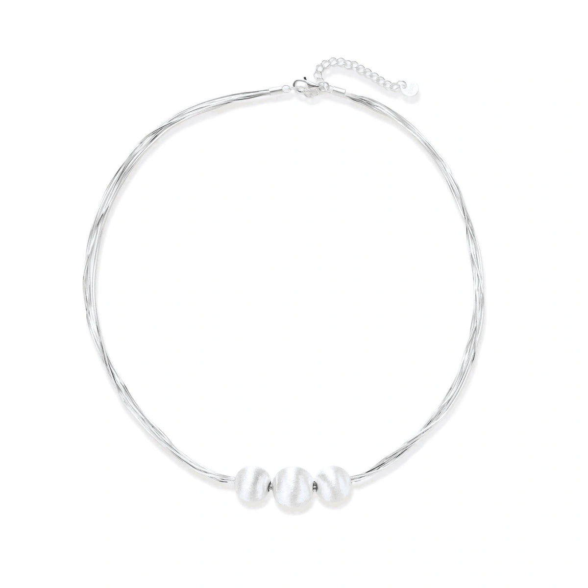 Sterling silver multi-strand necklace with three brushed round beads on cream background