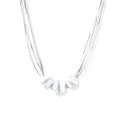 Sterling silver multi-strand necklace with three brushed round beads on cream background