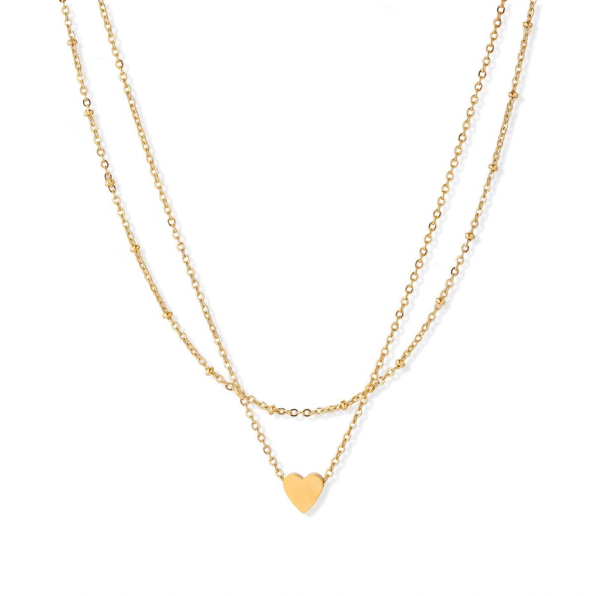 Delicate double-chain gold necklace with tiny heart pendant on cream background