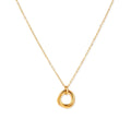 Delicate gold-plated necklace with three interlocking circle rings forming a minimalist knot pendant on cream background