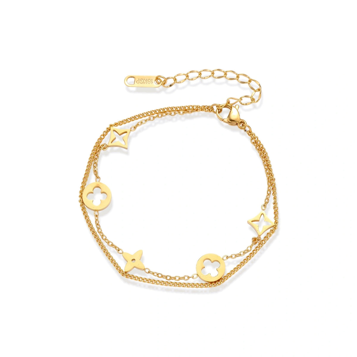 Double-layer gold-plated bracelet with quatrefoil and star charms on cream background, 18K gold finish.