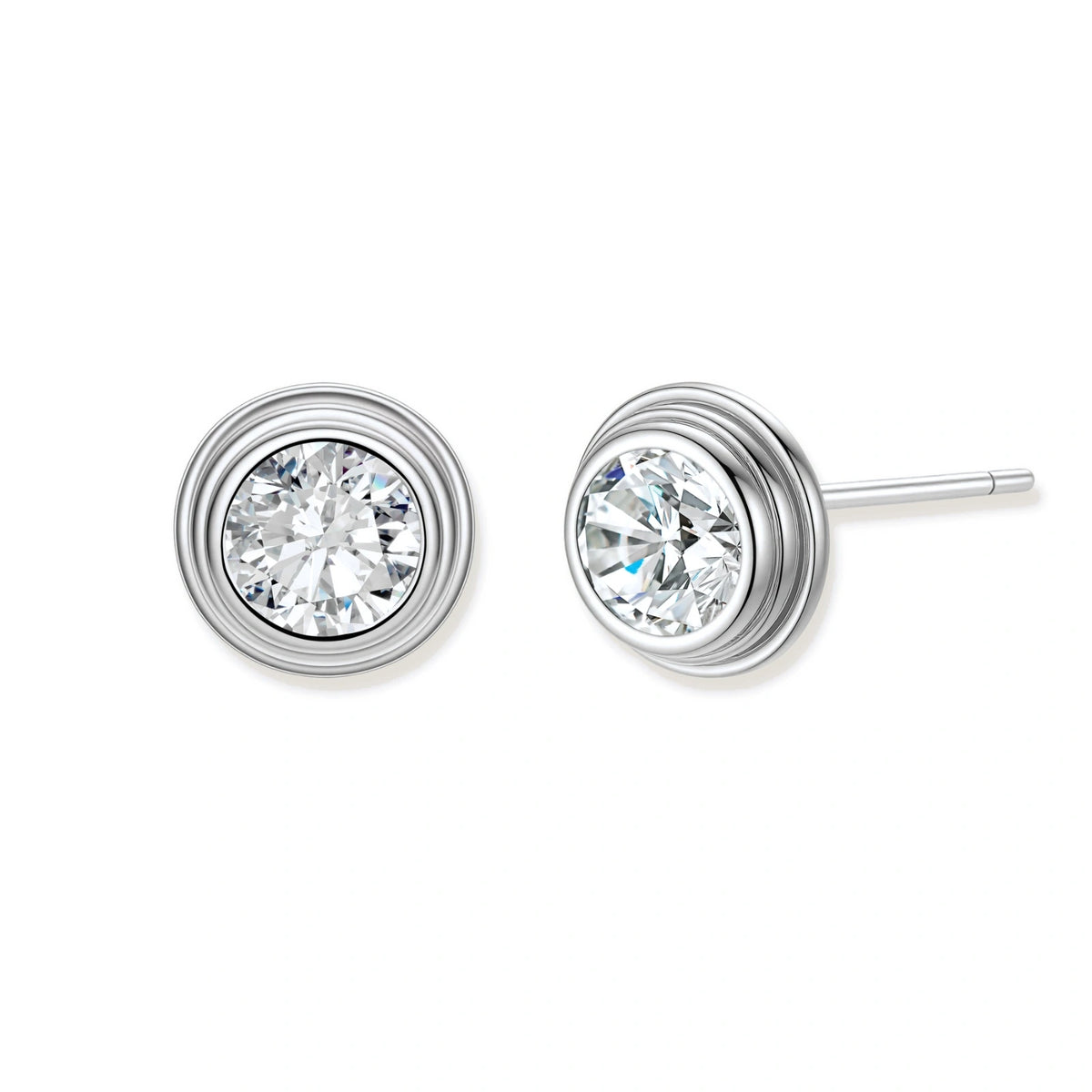 Close-up of sterling silver stud earrings featuring concentric circular frames with brilliant moissanite centers