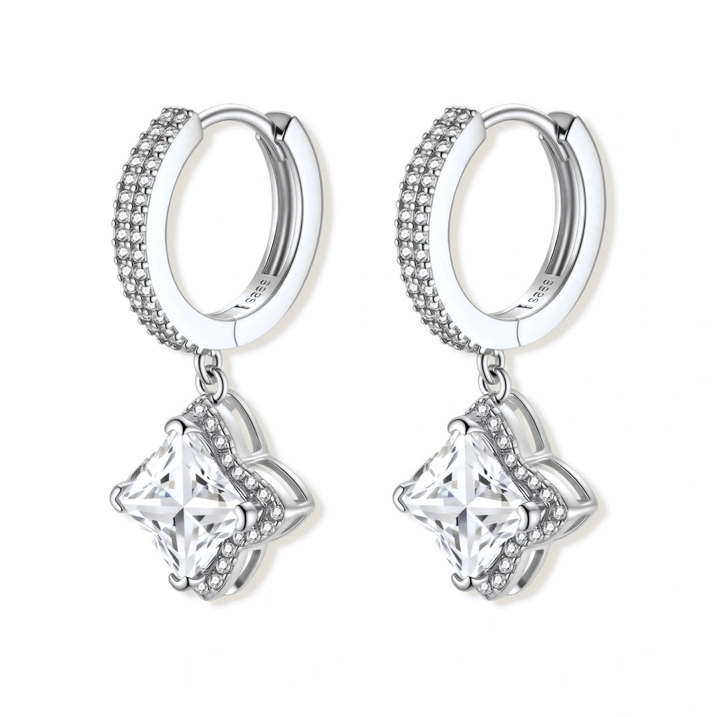 Sterling silver huggie hoops with geometric diamond-shaped moissanite dangles featuring pavé crystal details