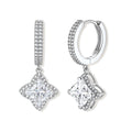 Sterling silver huggie hoops with geometric diamond-shaped moissanite dangles featuring pavé crystal details