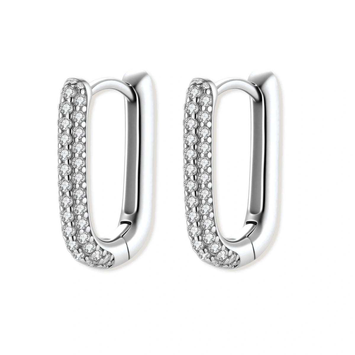 Close-up of platinum-plated sterling silver huggie hoops with pavé crystal setting on white background.